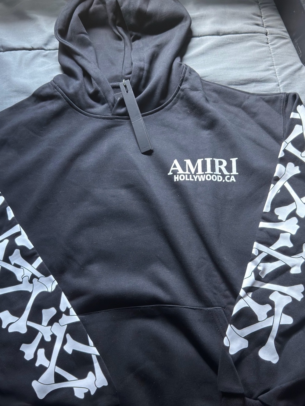 AMIRI Black Hoodie with White Bone Sleeve Graphics